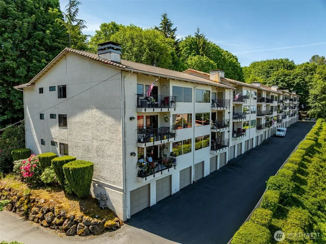 a view of a chairs and table in the balcony