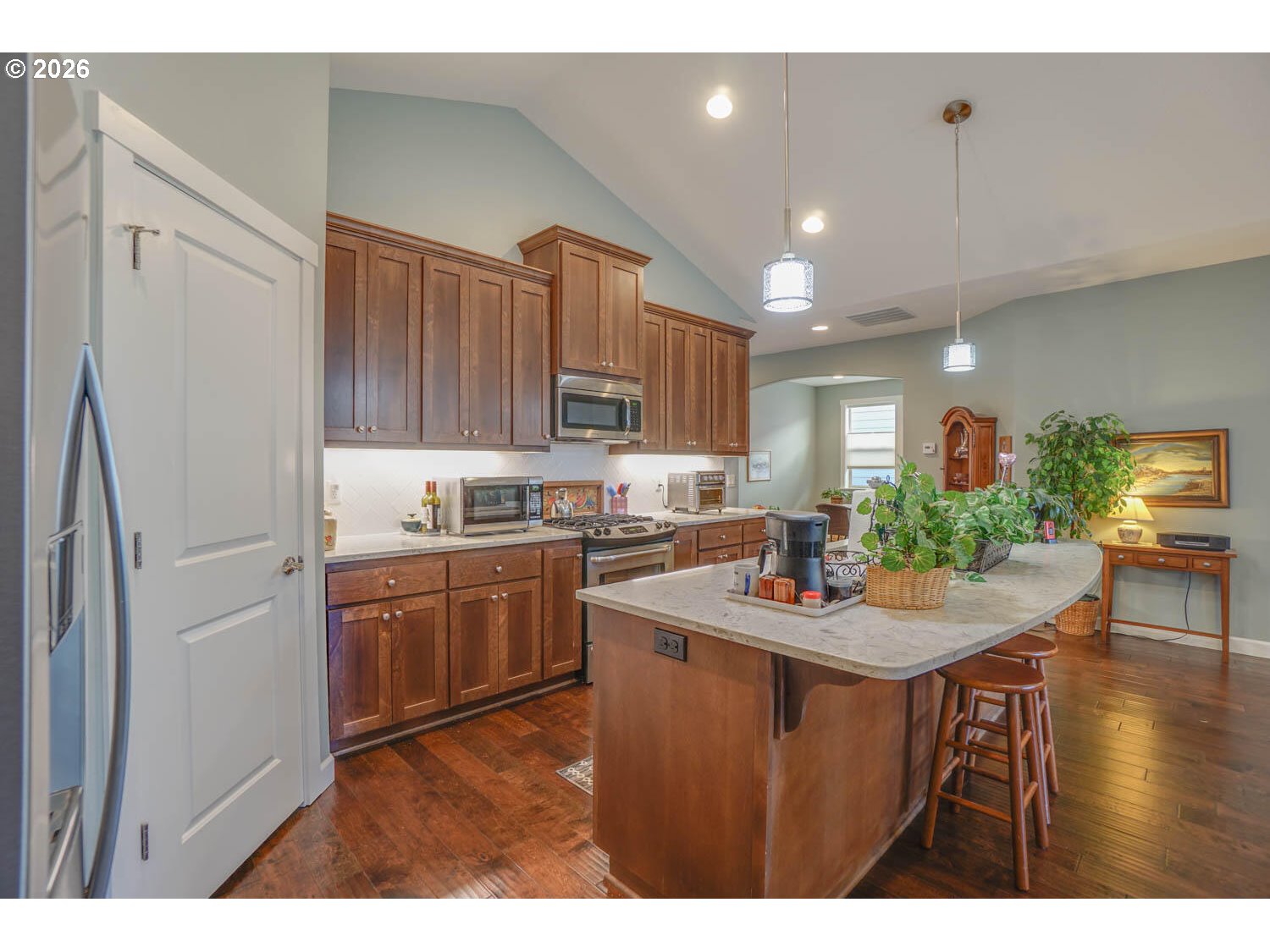 17629 Northeast 17th Avenue Ridgefield, WA 98642 - Photo 14 of 31 a kitchen with stainless steel appliances granite countertop a sink stove and refrigerator