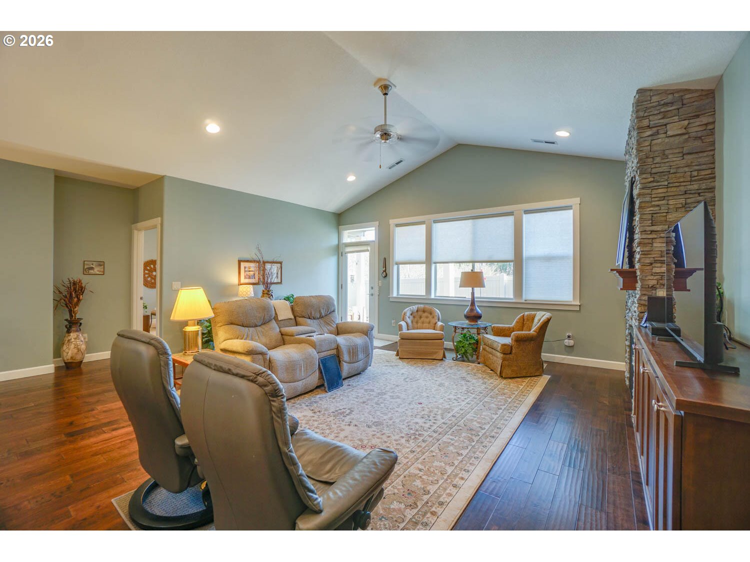 17629 Northeast 17th Avenue Ridgefield, WA 98642 - Photo 16 of 31 a living room with furniture and a flat screen tv