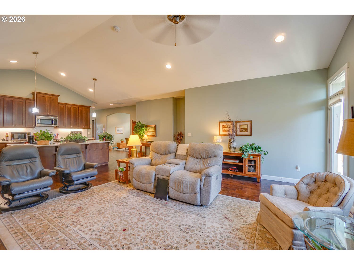 17629 Northeast 17th Avenue Ridgefield, WA 98642 - Photo 20 of 31 a living room with furniture kitchen view and a table