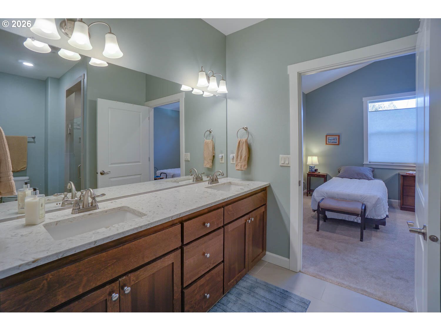 17629 Northeast 17th Avenue Ridgefield, WA 98642 - Photo 28 of 31 a spacious bathroom with a granite countertop sink a toilet and a mirror