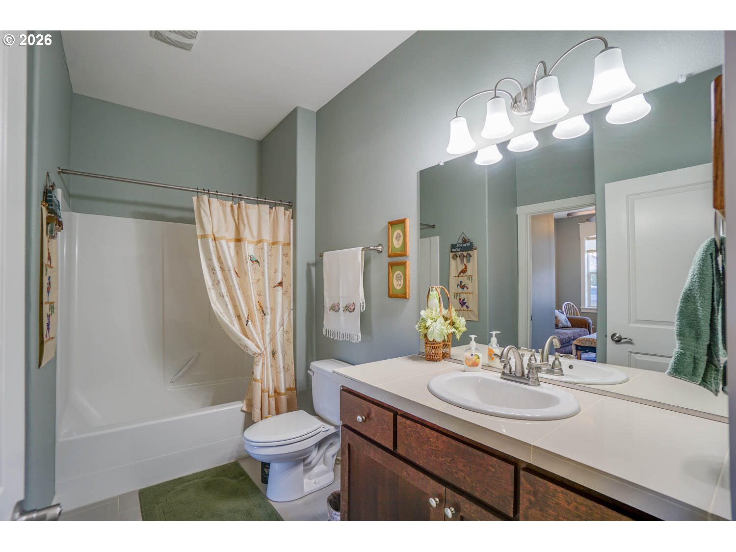 17629 Northeast 17th Avenue Ridgefield, WA 98642 - Photo 6 of 31 a bathroom with a sink toilet a mirror and shower