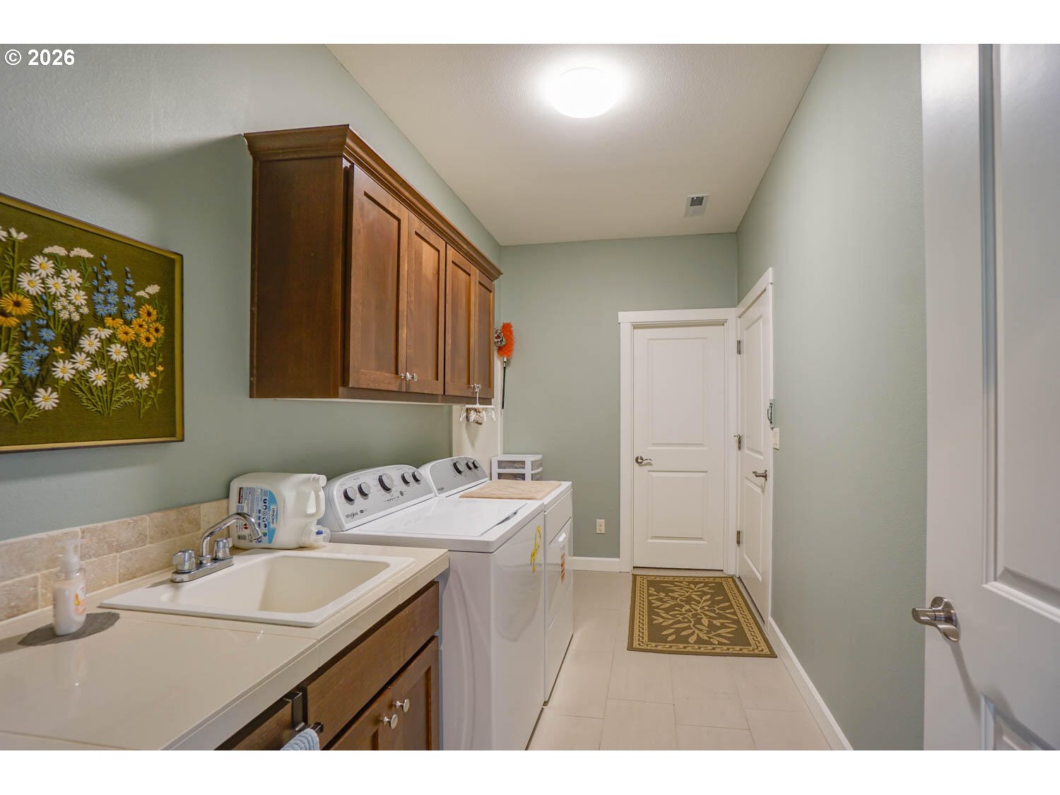 17629 Northeast 17th Avenue Ridgefield, WA 98642 - Photo 8 of 31 a bathroom with a sink a mirror and a toilet