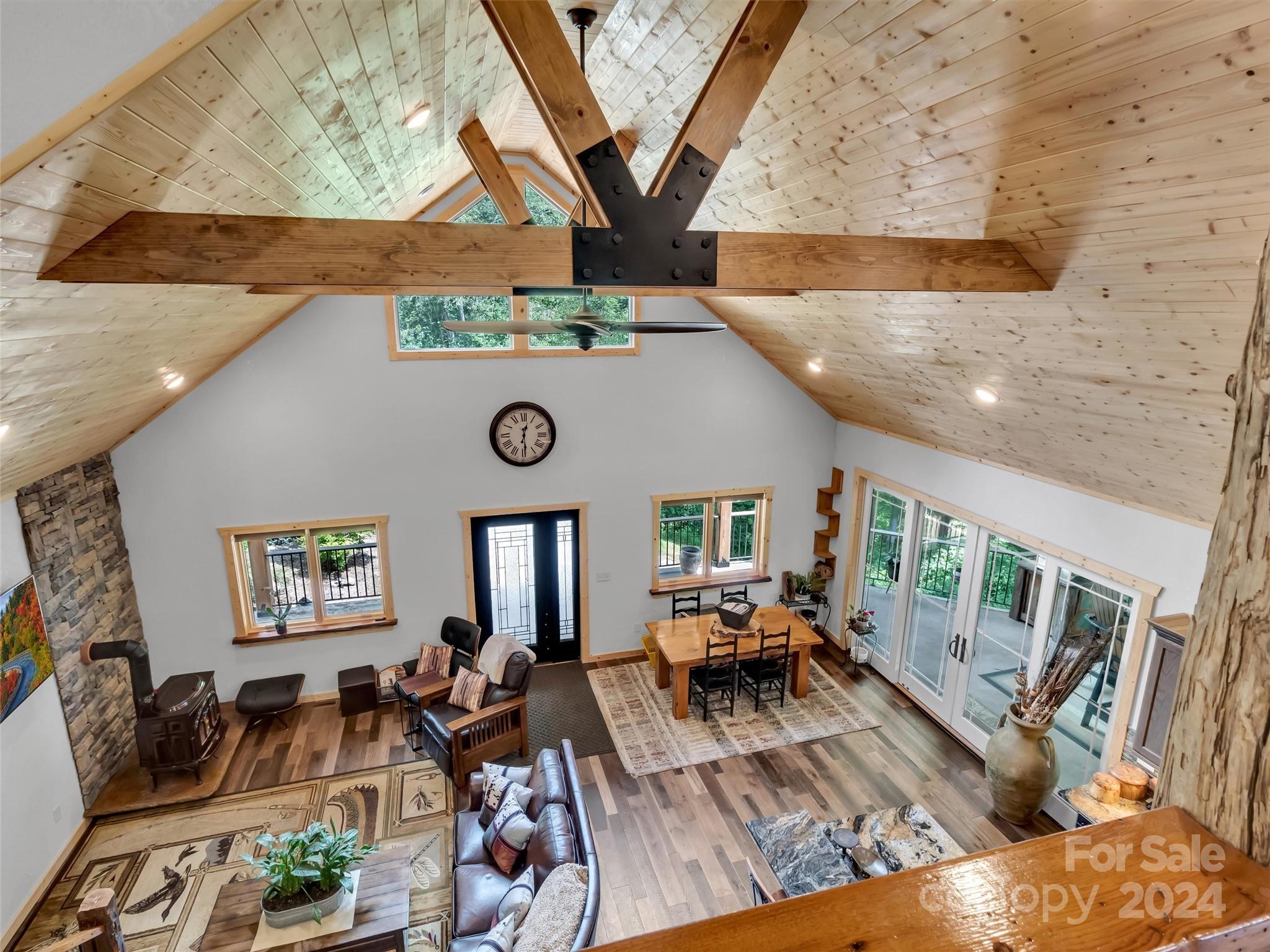 989 Ferguson Cove Loop Clyde, NC 28721 - Photo 23 of 42 a living room with furniture and a large window