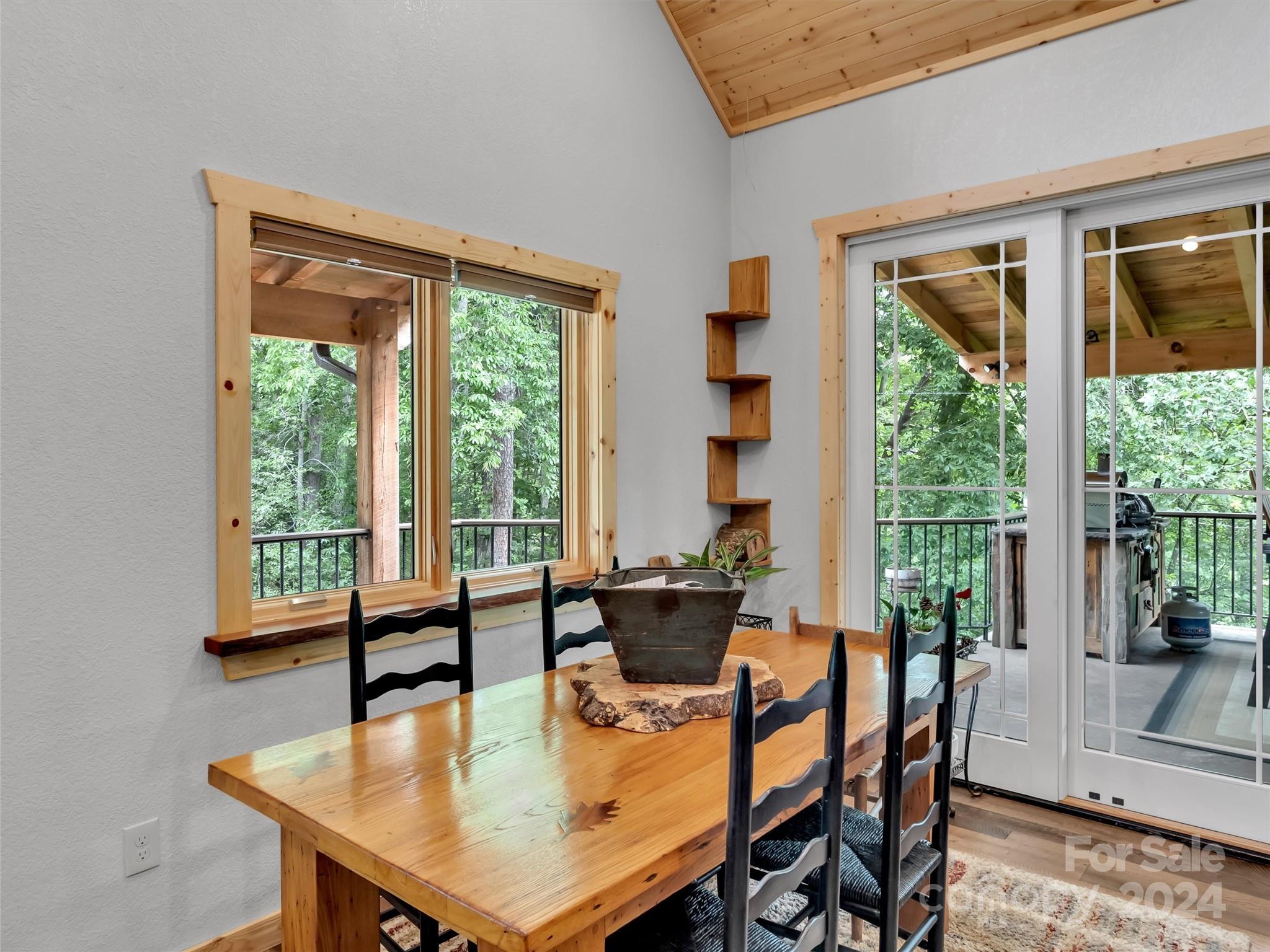 989 Ferguson Cove Loop Clyde, NC 28721 - Photo 9 of 42 a view of a dining room with furniture window and outside view
