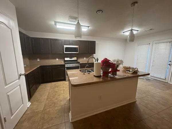 a view of kitchen with furniture and window