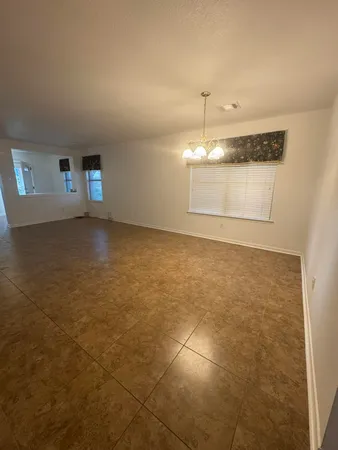 a view of a house with backyard sitting area and garden