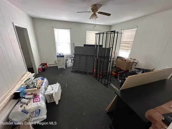 a bedroom with furniture and a window