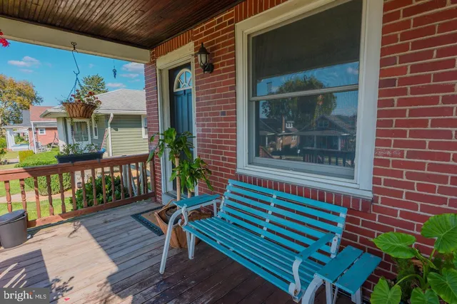 a balcony view with a seating space