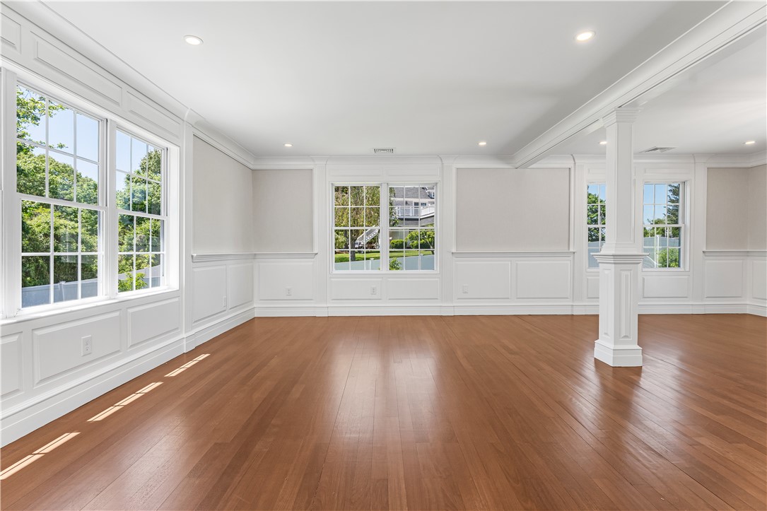 4 Shore Road Westerly, RI 02891 - Photo 15 of 36 A bright and cheery living room with custom moldings.