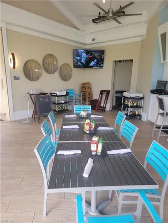 a view of a dining room with furniture and a rug