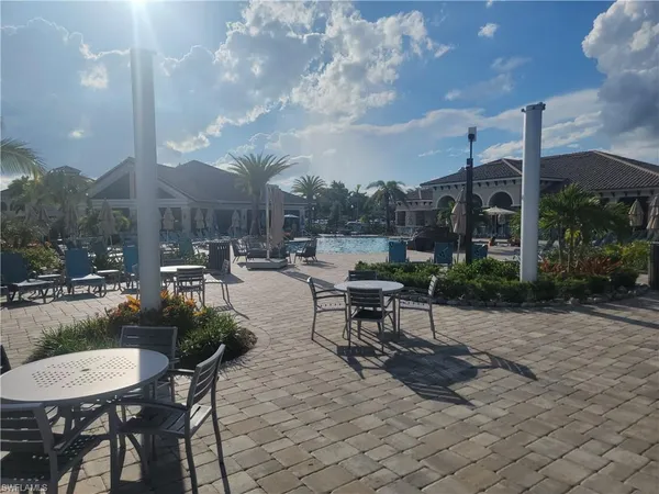 a view of a patio with a table and chairs