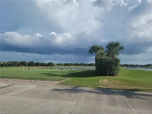 a view of a golf course with a big yard