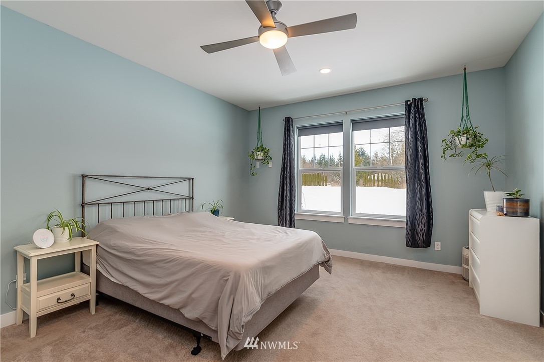 3519 McGee Road Blaine, WA 98230 - Photo 19 of 40 a bedroom with a bed and a window