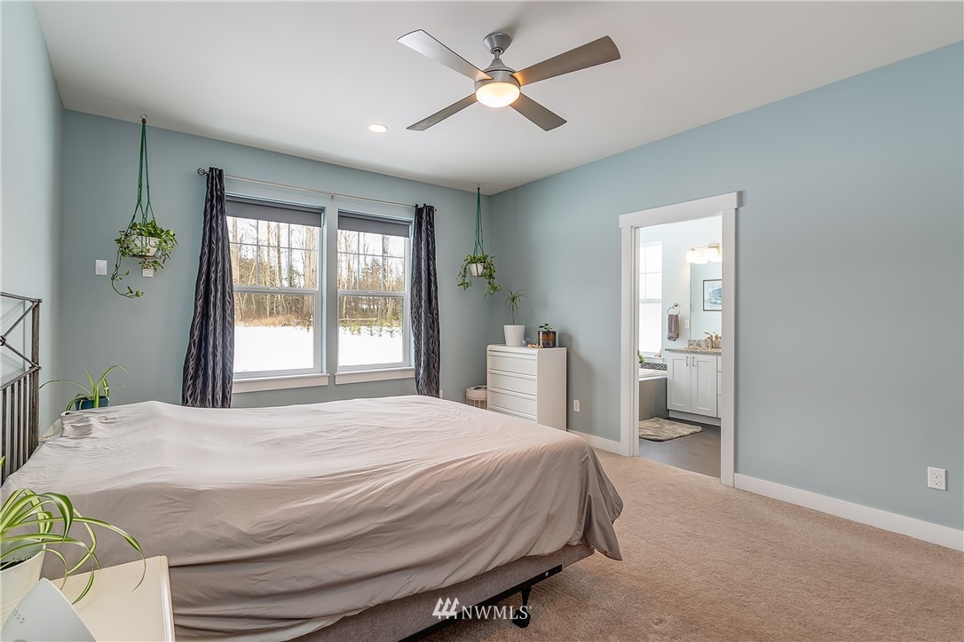 3519 McGee Road Blaine, WA 98230 - Photo 20 of 40 a bedroom with a bed and a window
