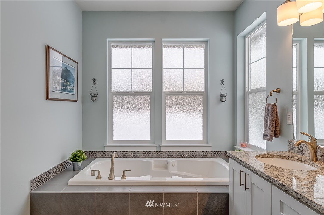 3519 McGee Road Blaine, WA 98230 - Photo 24 of 40 a white bath tub sitting next to a window