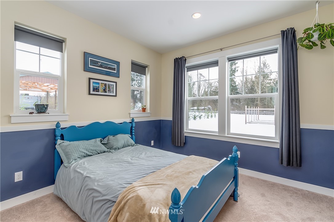 3519 McGee Road Blaine, WA 98230 - Photo 26 of 40 a bedroom with a bed and a large window