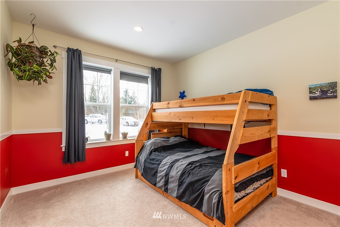 3519 McGee Road Blaine, WA 98230 - Photo 27 of 40 a bedroom with a bed and a window