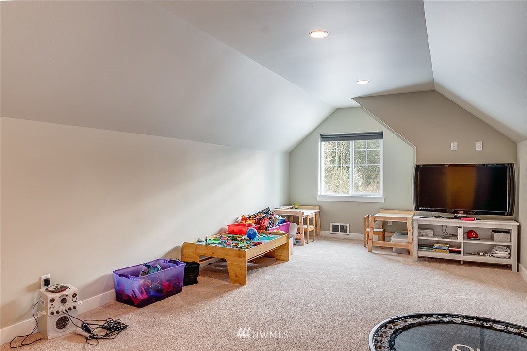 3519 McGee Road Blaine, WA 98230 - Photo 30 of 40 a living room with furniture and a flat screen tv