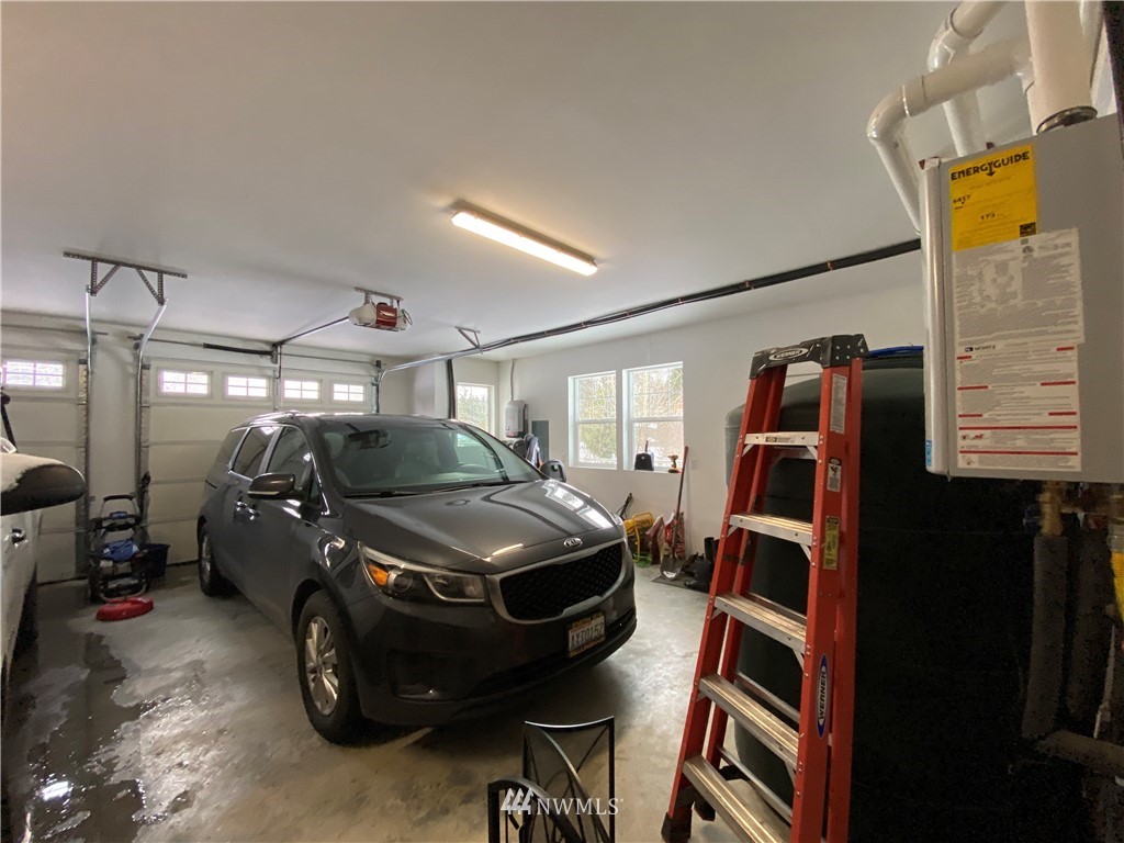 3519 McGee Road Blaine, WA 98230 - Photo 32 of 40 a car parked in a parking garage