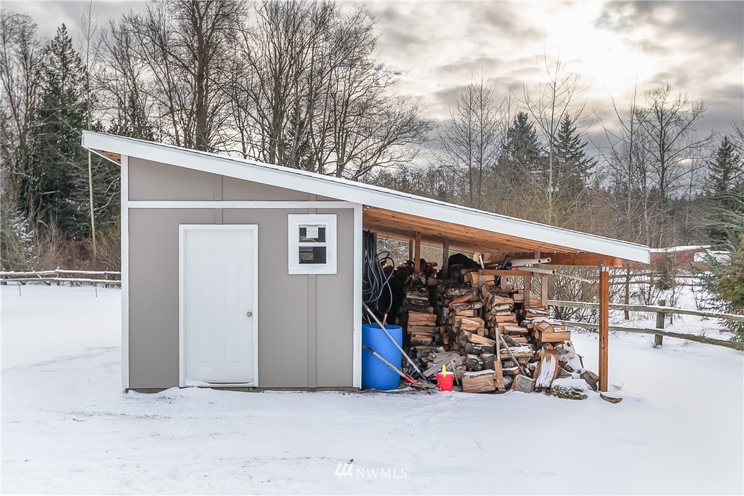 3519 McGee Road Blaine, WA 98230 - Photo 38 of 40 a view of a garage with a car parked in it