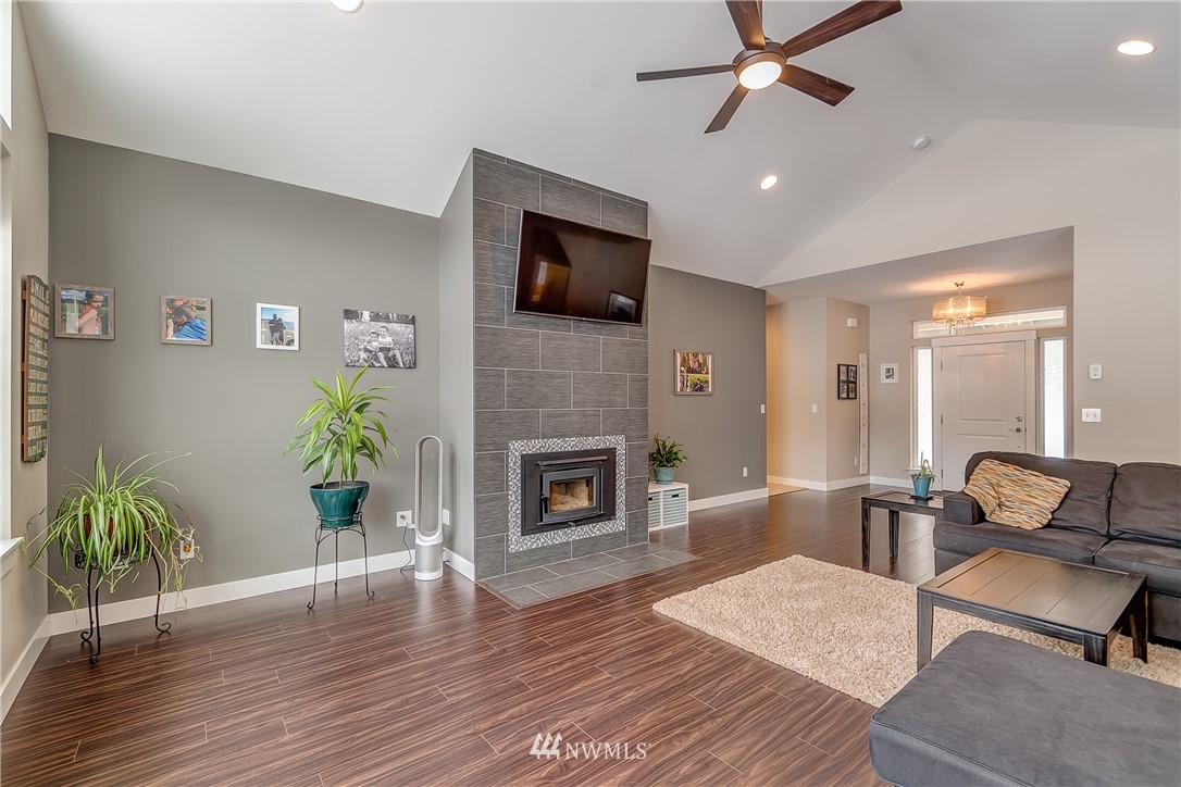 3519 McGee Road Blaine, WA 98230 - Photo 9 of 40 a living room with furniture and a fireplace