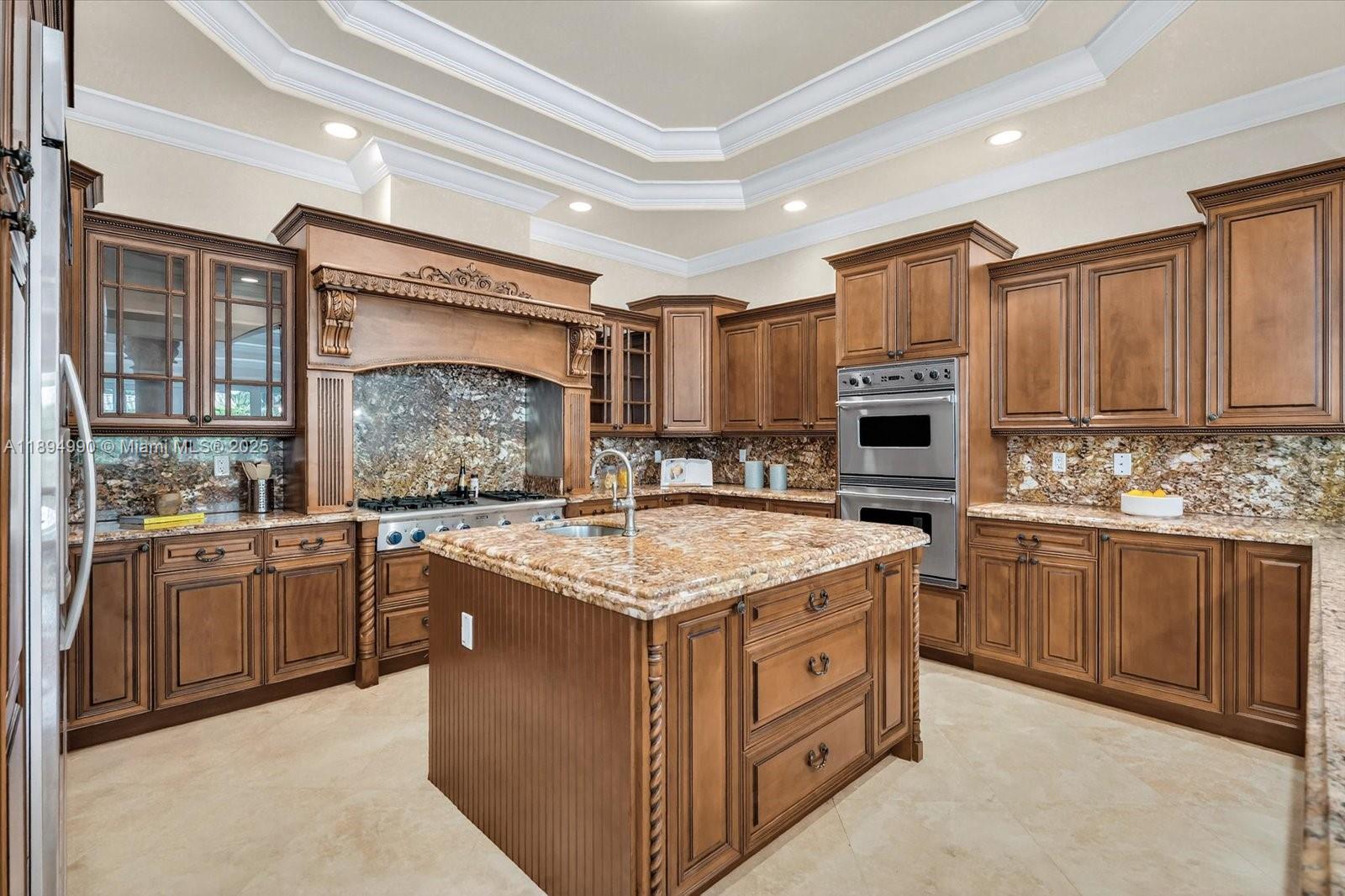 7975 Southwest 52nd Court Miami, FL 33143 - Photo 14 of 26 a kitchen with granite countertop a sink stove top oven and cabinets
