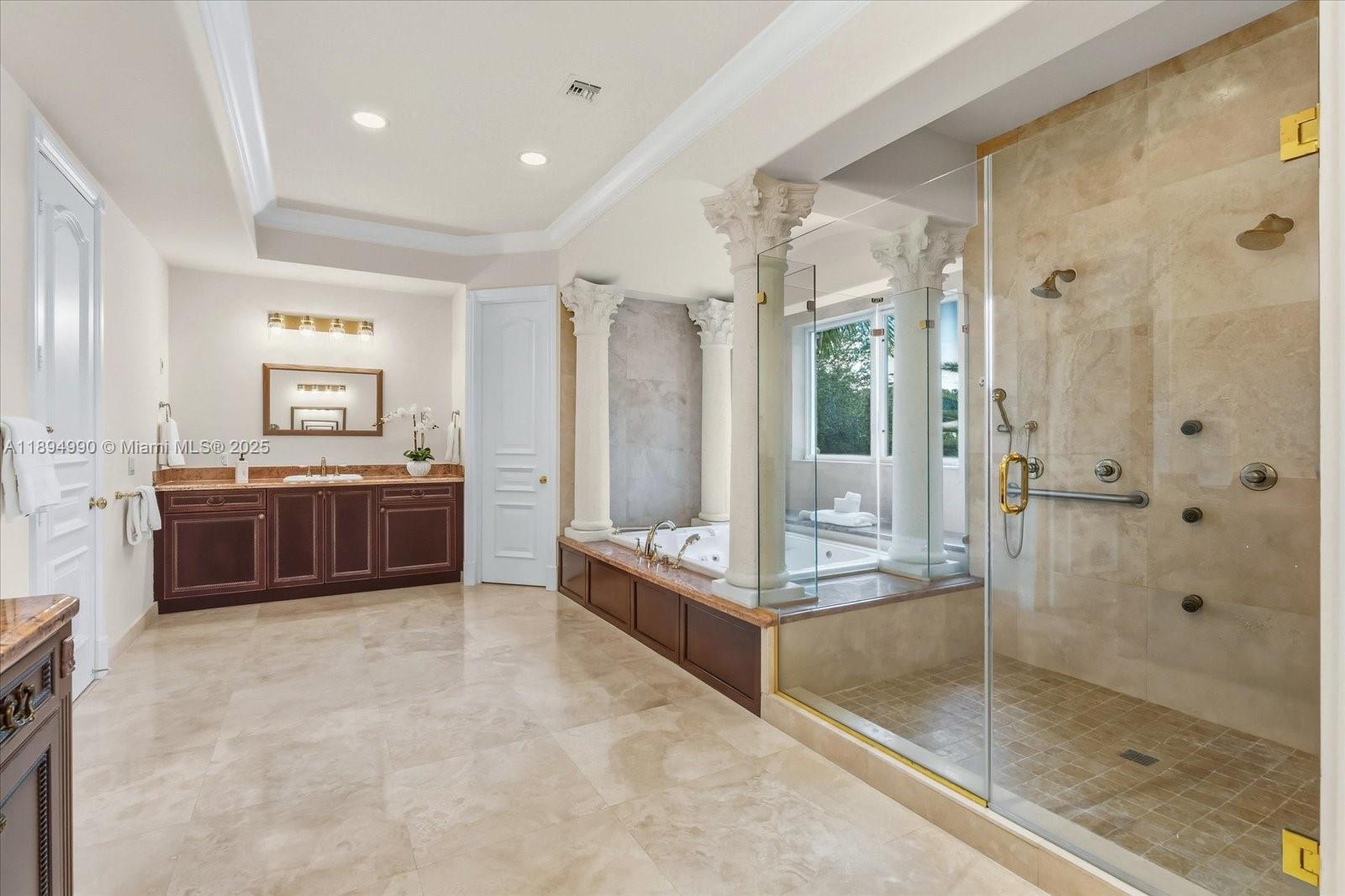 7975 Southwest 52nd Court Miami, FL 33143 - Photo 17 of 26 a large bathroom with a glass door shower and mirror