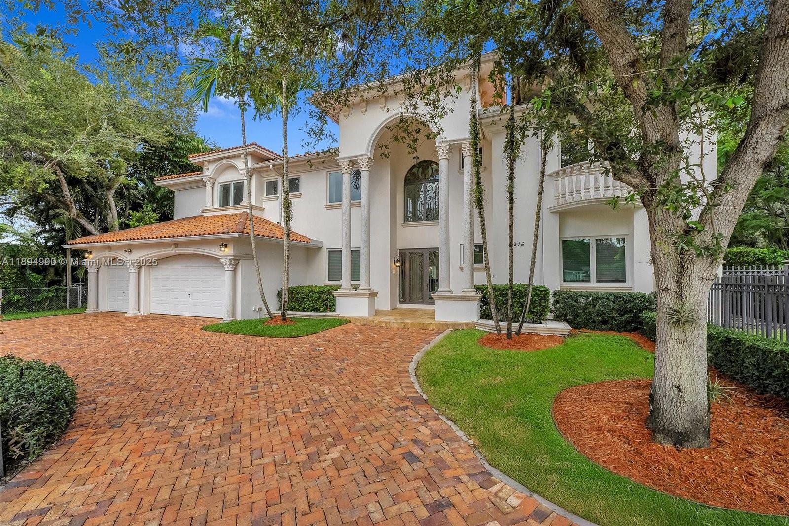 7975 Southwest 52nd Court Miami, FL 33143 - Photo 2 of 26 front view of a house with a yard