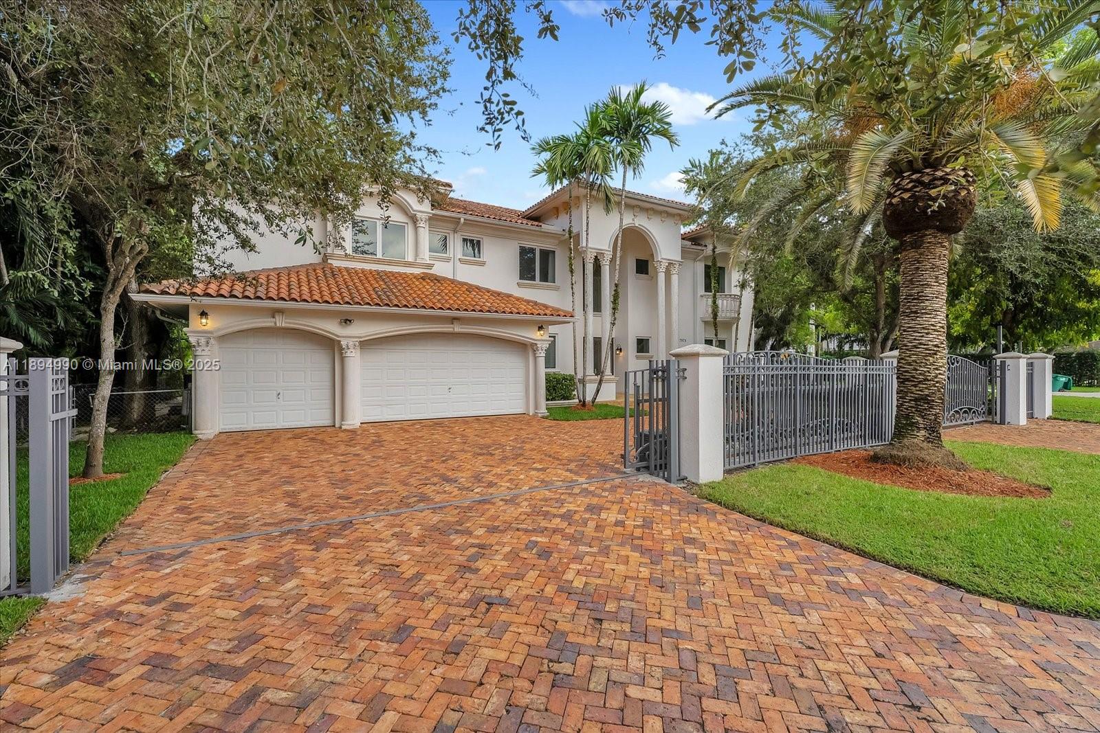 7975 Southwest 52nd Court Miami, FL 33143 - Photo 26 of 26 a front view of a house with a yard and garage