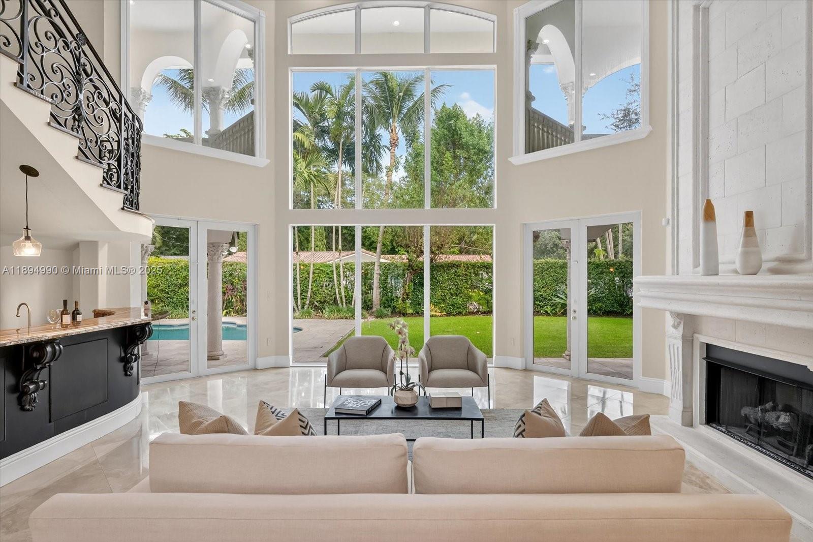 7975 Southwest 52nd Court Miami, FL 33143 - Photo 3 of 26 a living room with furniture and large windows