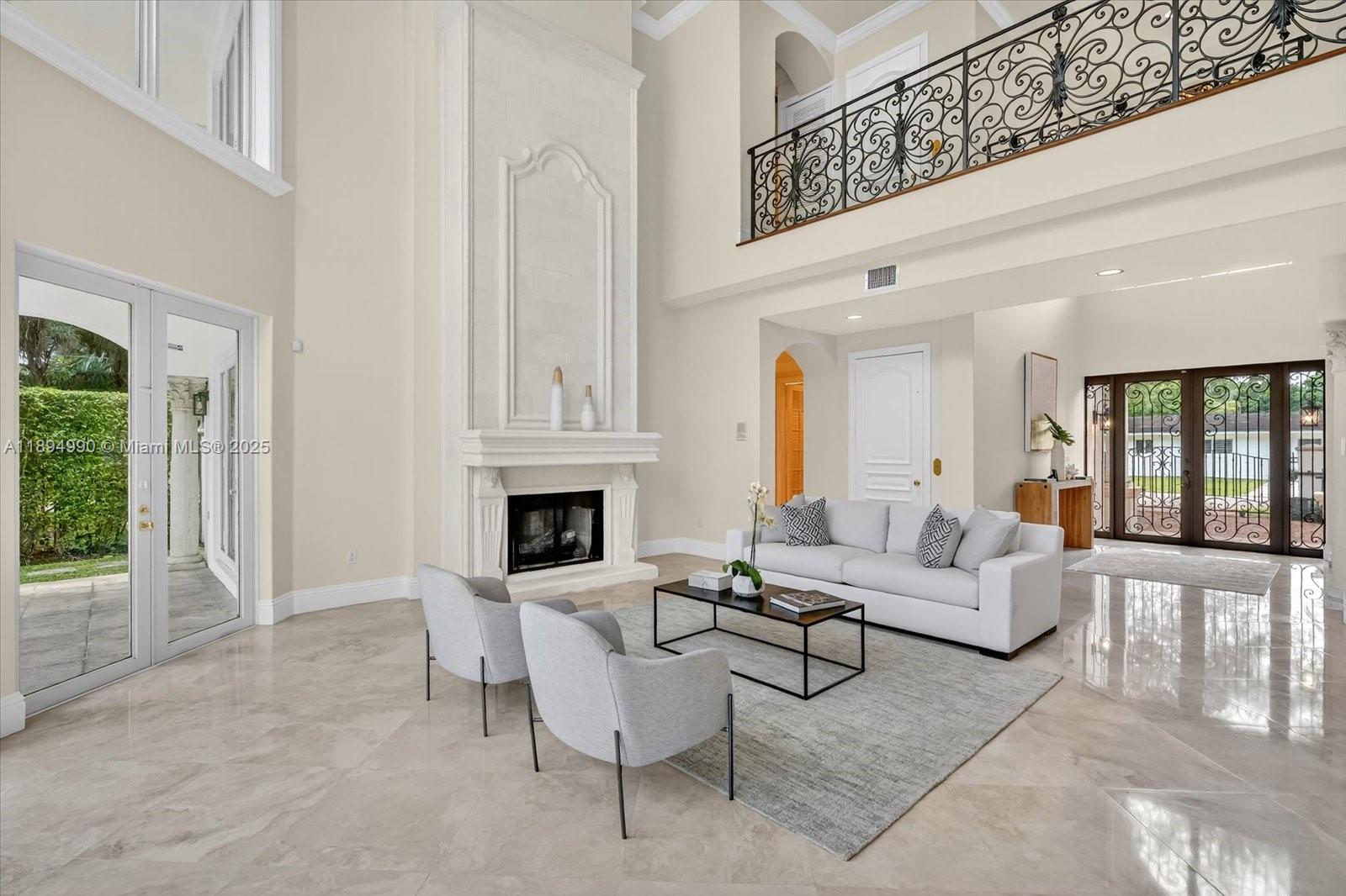 7975 Southwest 52nd Court Miami, FL 33143 - Photo 6 of 26 a living room with furniture a fireplace and a table