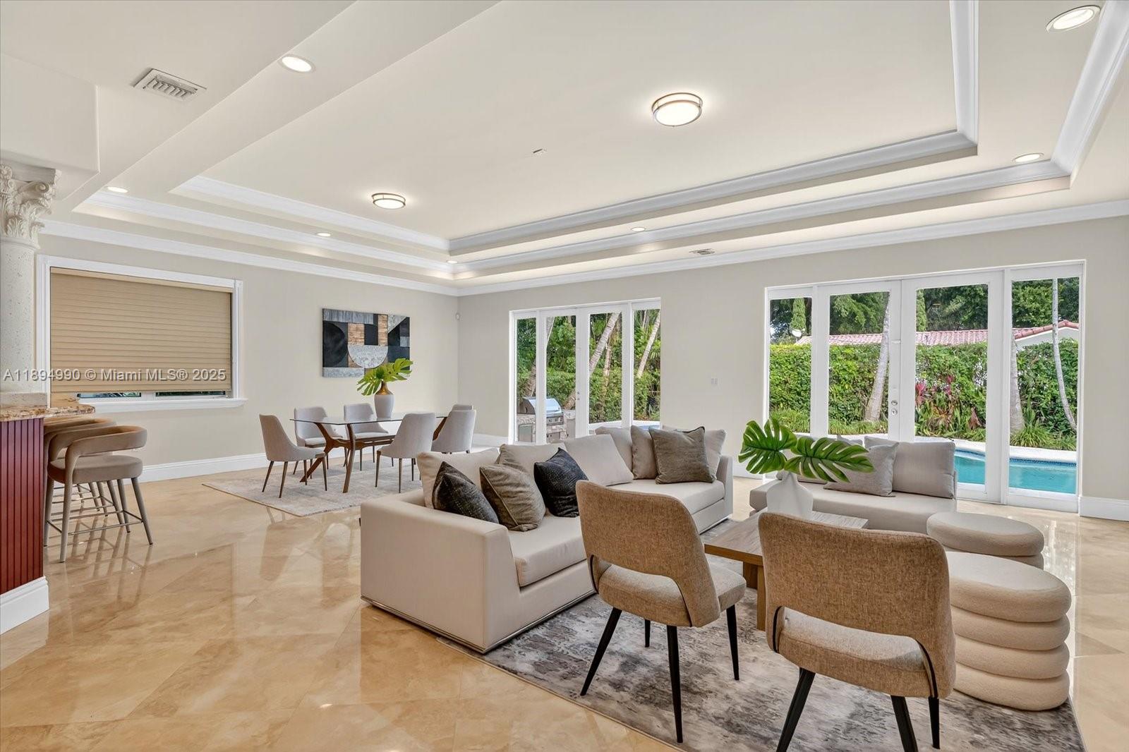 7975 Southwest 52nd Court Miami, FL 33143 - Photo 8 of 26 a living room with furniture and a large window