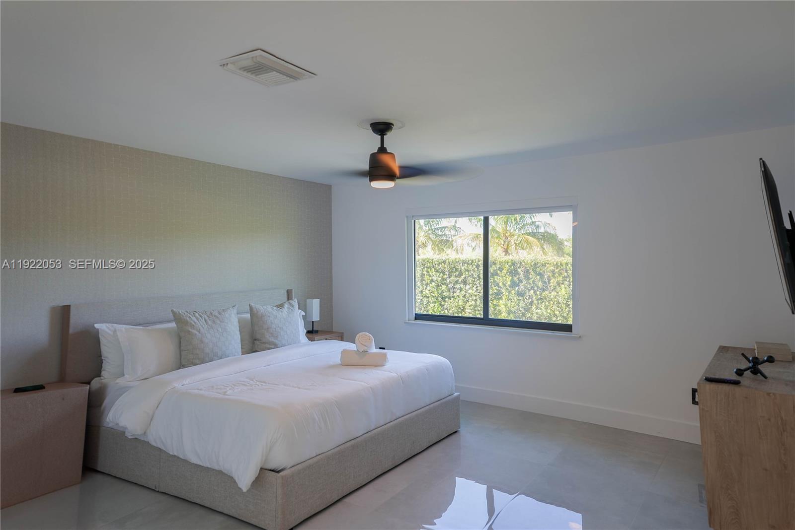 13355 Southwest 207th Avenue Miami, FL 33196 - Photo 12 of 26 a bedroom with a bed and a window