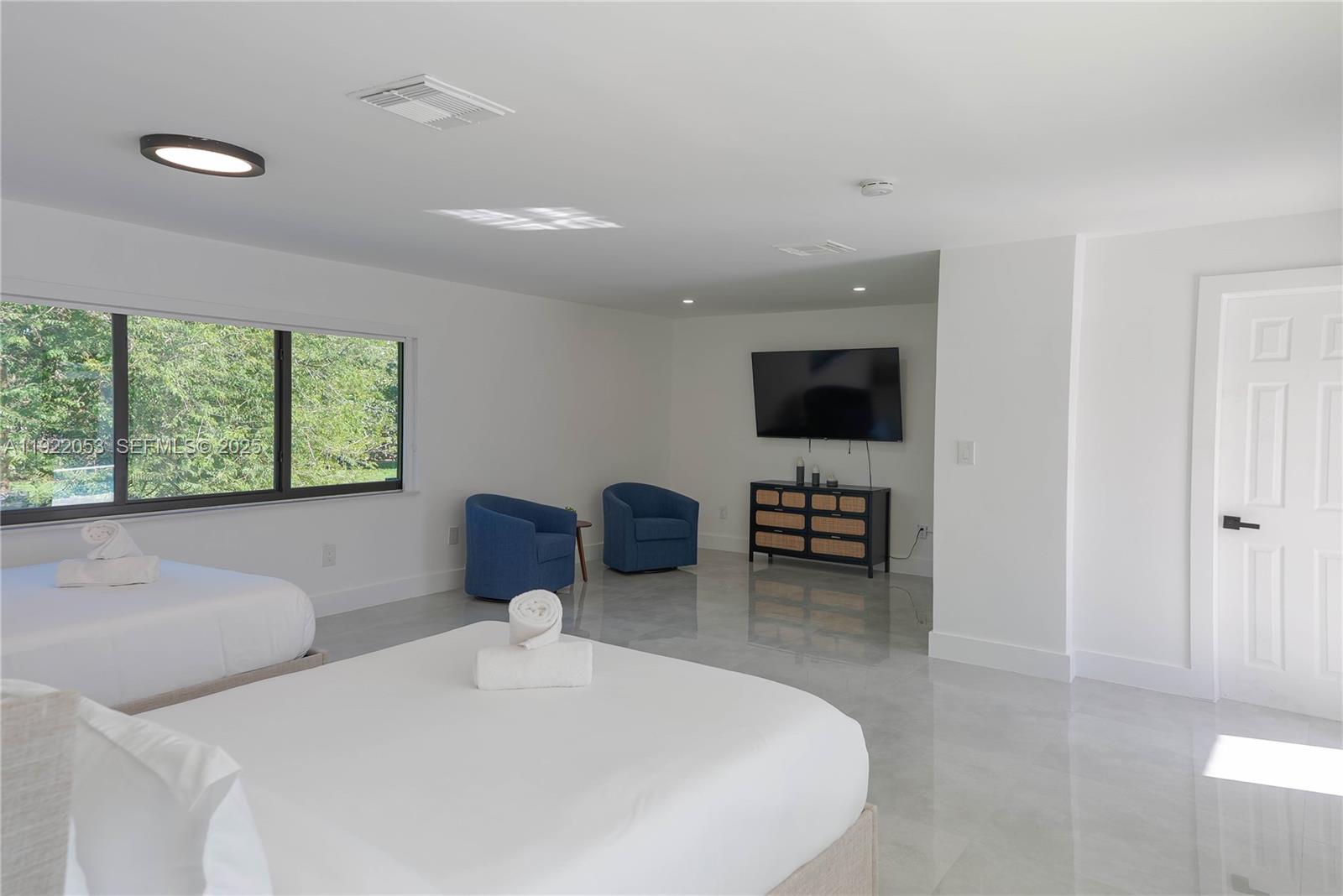 13355 Southwest 207th Avenue Miami, FL 33196 - Photo 14 of 26 a bedroom with furniture and a flat screen tv