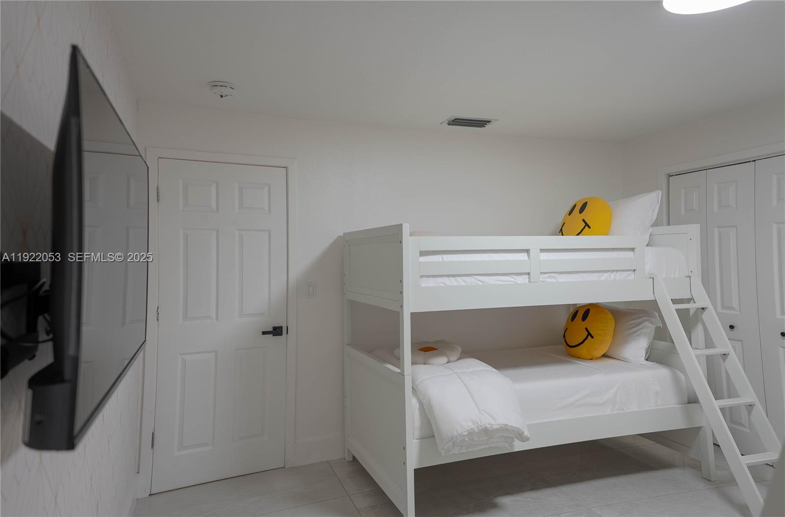 13355 Southwest 207th Avenue Miami, FL 33196 - Photo 17 of 26 a bedroom with a bed and a window