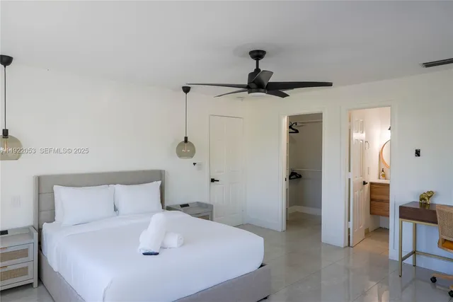 a bedroom with a bed and a chair