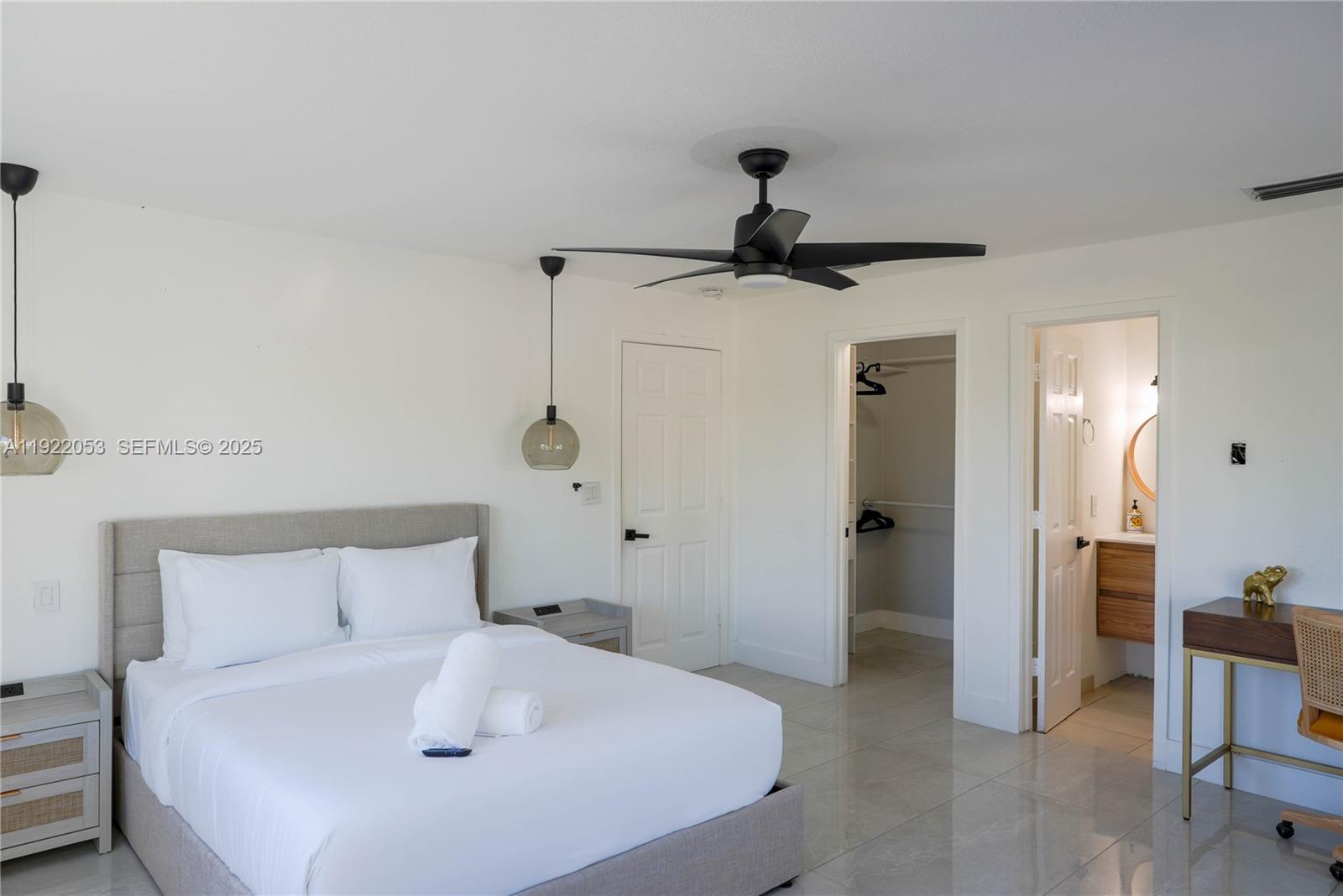 13355 Southwest 207th Avenue Miami, FL 33196 - Photo 21 of 26 a bedroom with a bed and a chair