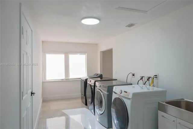 a utility room with dryer and washer