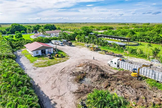 a view of a garden with an ocean view