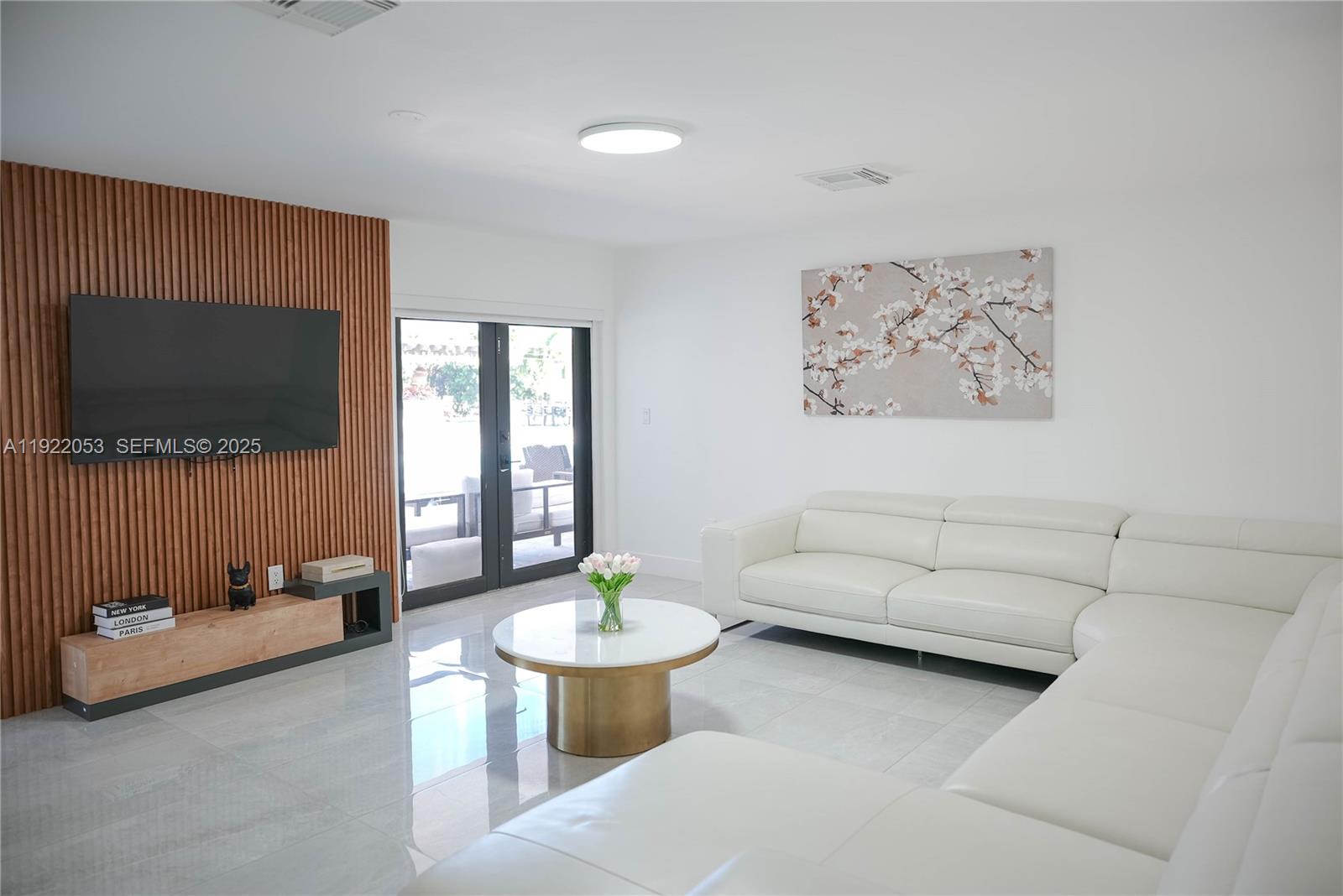 13355 Southwest 207th Avenue Miami, FL 33196 - Photo 3 of 26 a living room with furniture and a flat screen tv