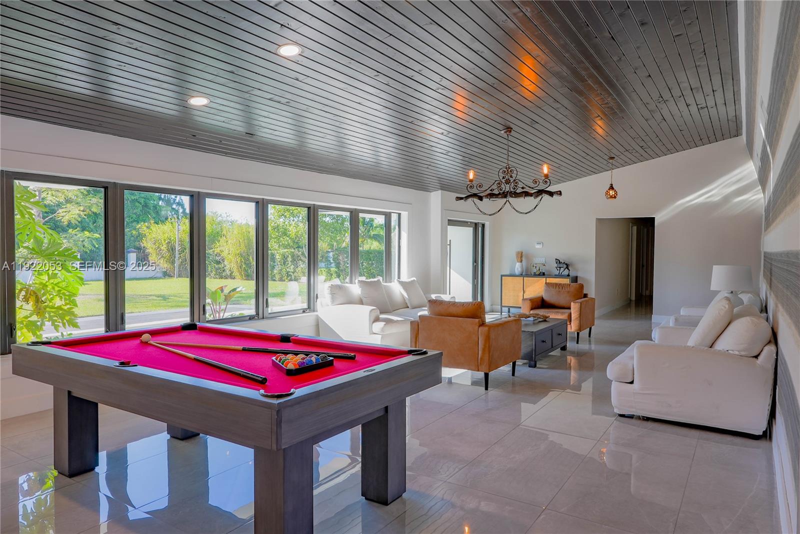 13355 Southwest 207th Avenue Miami, FL 33196 - Photo 5 of 26 a room with pool table and windows