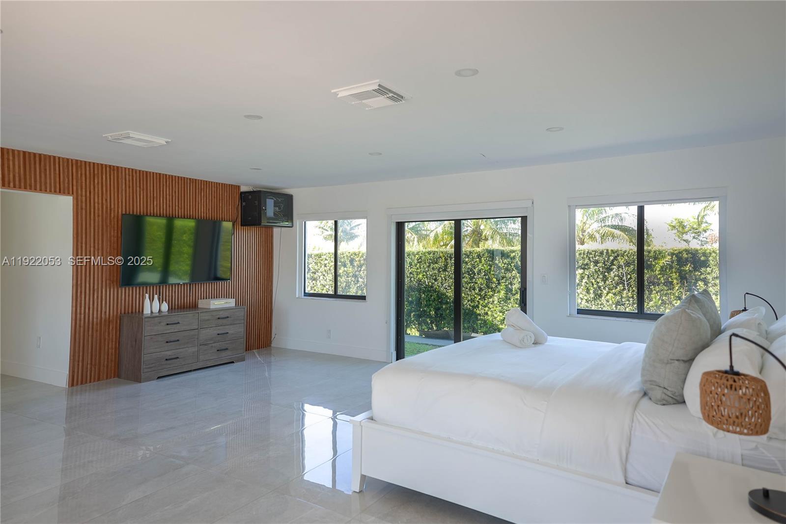 13355 Southwest 207th Avenue Miami, FL 33196 - Photo 9 of 26 a bed room with a bed and a couch