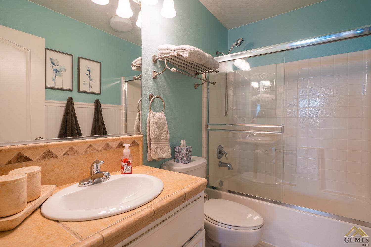 Undisclosed Address Bakersfield, CA 93312 - Photo 15 of 33 a bathroom with a sink toilet and shower