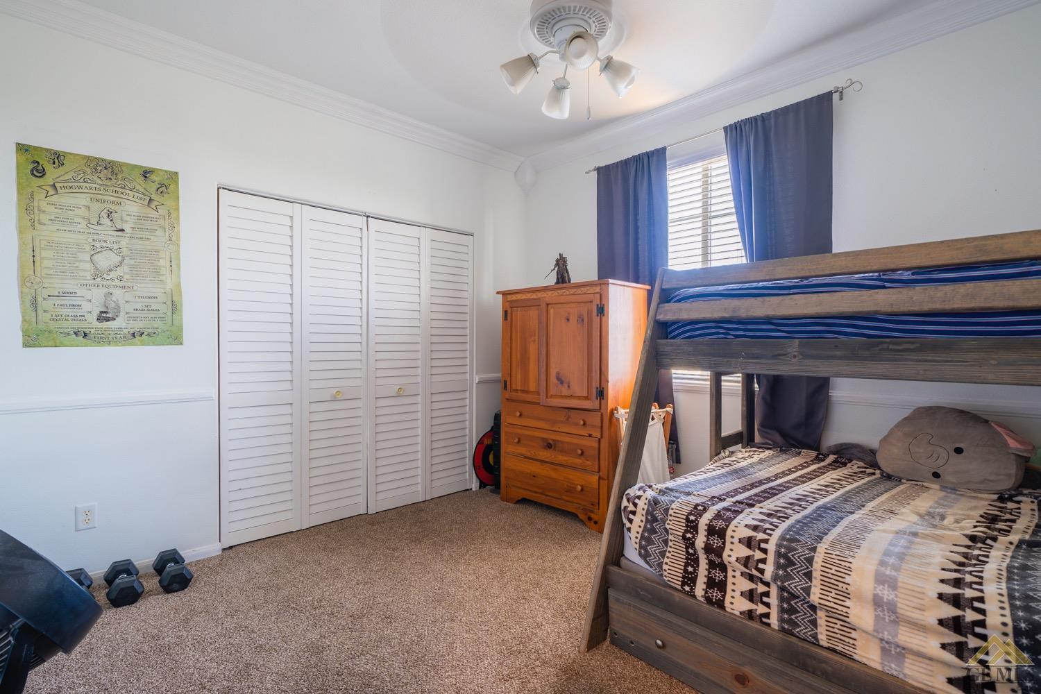 Undisclosed Address Bakersfield, CA 93312 - Photo 19 of 33 a bedroom with a bed and furniture