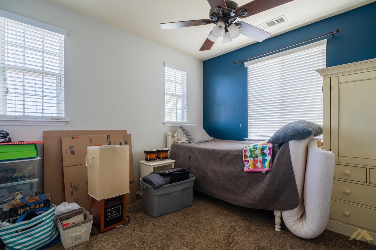 Undisclosed Address Bakersfield, CA 93312 - Photo 21 of 33 a bedroom with furniture and windows