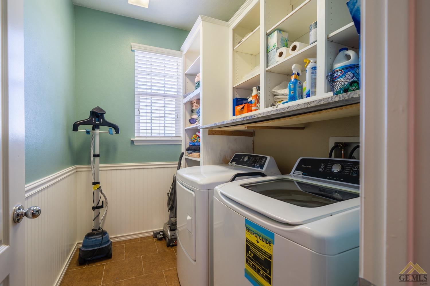 Undisclosed Address Bakersfield, CA 93312 - Photo 22 of 33 a utility room with dryer and washer