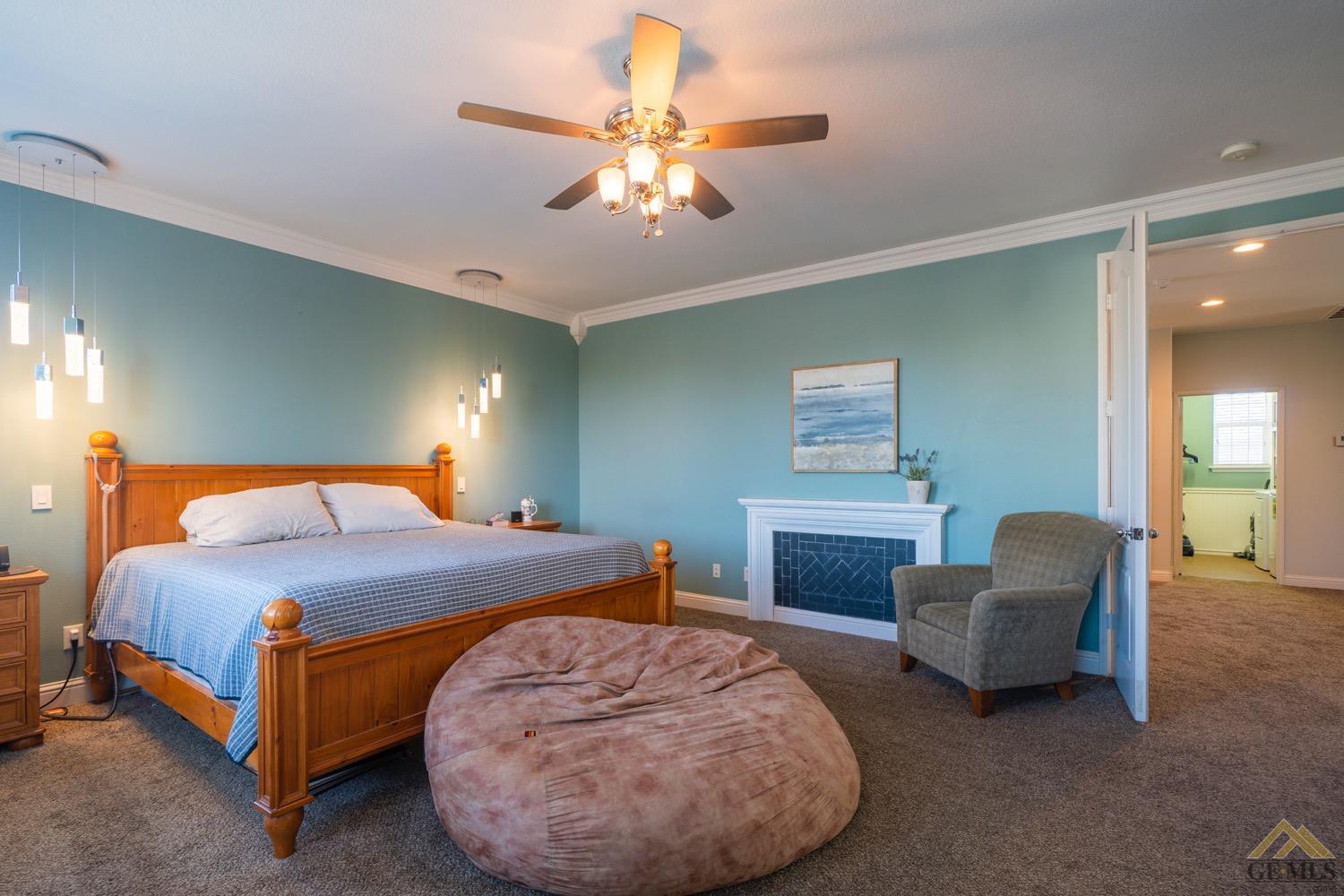 Undisclosed Address Bakersfield, CA 93312 - Photo 23 of 33 a bedroom with a bed and a couch