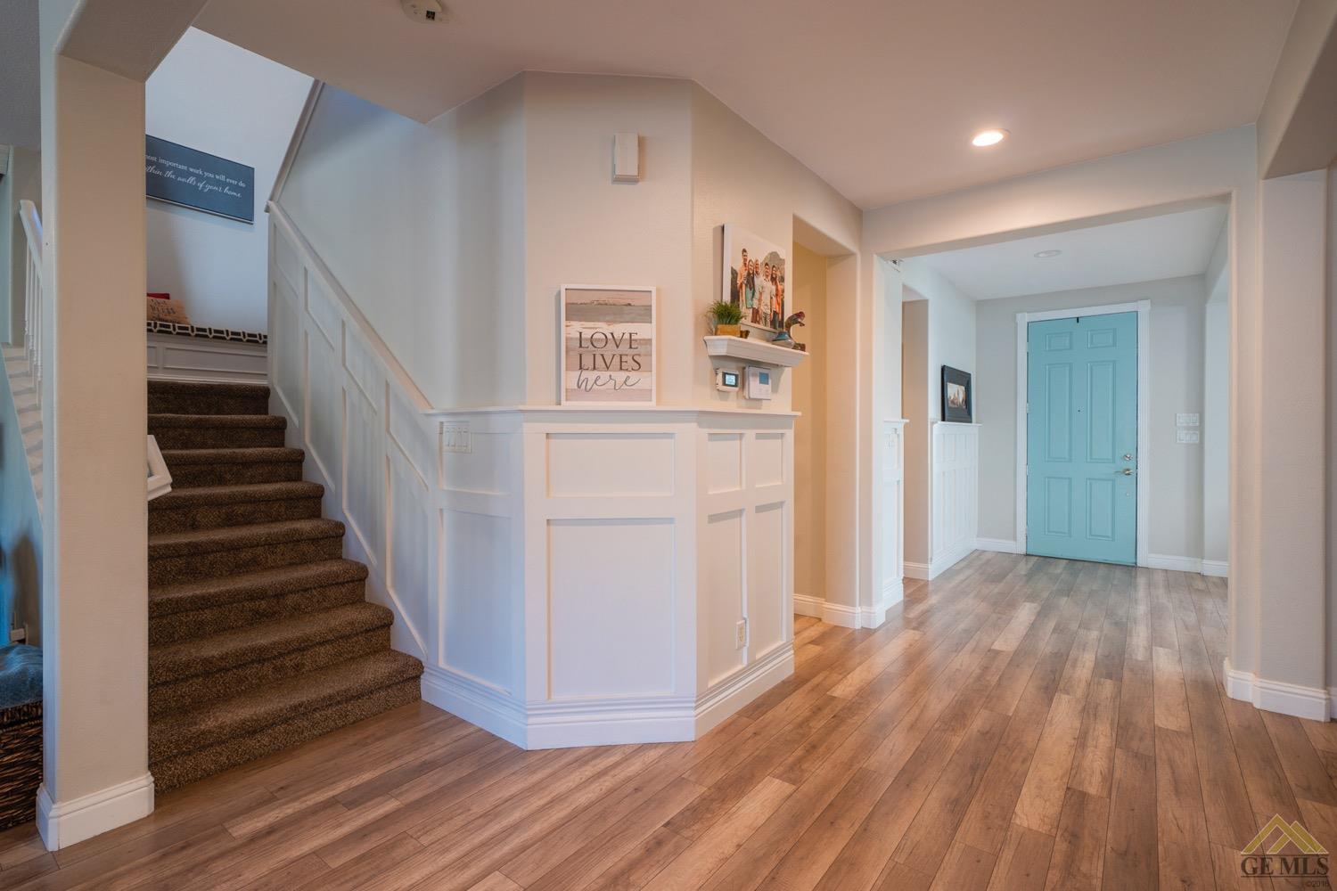 Undisclosed Address Bakersfield, CA 93312 - Photo 3 of 33 a view of a hallway with wooden floor and entryway