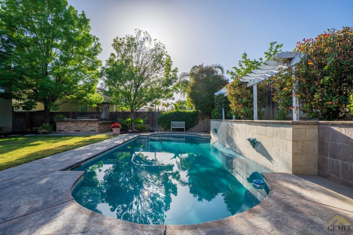 Undisclosed Address Bakersfield, CA 93312 - Photo 32 of 33 a view of a swimming pool with a patio